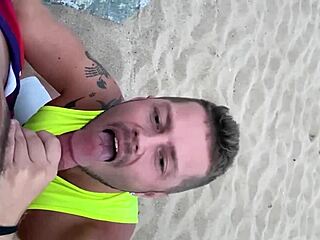 I give a blowjob to my gay lover on the public beach, feeling the sand and waves around us.