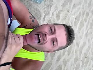 I give a blowjob to my gay lover on the public beach, feeling the sand and waves around us.