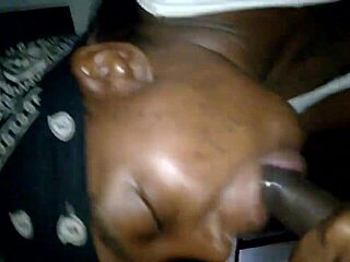 The cheating ebony momma engages in sucking a big black cock