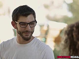 The Brunette Masseur Provides Help to a Young Guy by Giving Him a Massage in an Outdoor Environment