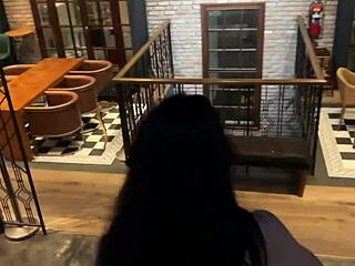 blowjob scene unfolds in public restaurant setting