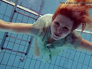 Tiny ass nastya in a dress splashes around the pool underwater with her natural tits exposed
