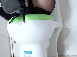 asian brunette masturbates with vibrator in toilet