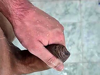 Cute young twink cums deliciously in the shower with neighbors watching