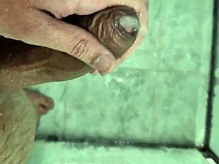 Cute young twink cums deliciously in the shower with neighbors watching