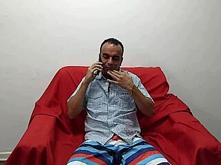 Sheila in crossdressing enjoys sex on the sofa and cums hard.