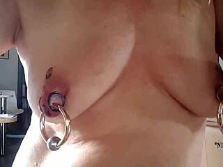 Nippleringlover Horny MILF Sticking Tattoos on Huge Pierced Nipples Close-Up