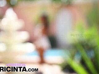 Putri Cinta flaunts tiny wet pussy by the pool.