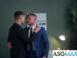 Hot guys sneak gay hookup in office parody.