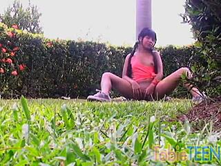 Tobie teen fingers her pussy outdoors