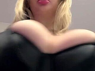 Big natural tits spill out of tight elastic leather.