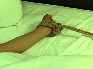 Helpless Lisa Mai's pussy drilled by Scott Rhodes' sex machine to orgasm.