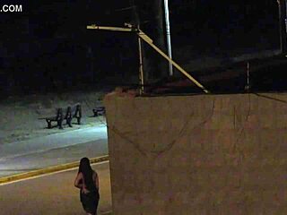 Beach security camera catches couple getting frisky in public spot.