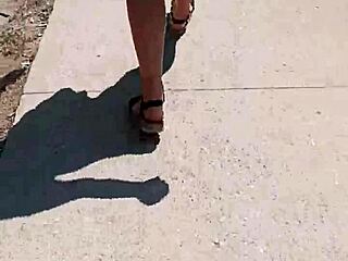 A woman walks naked on the street in public.