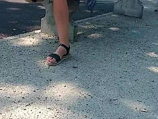 A woman walks naked on the street in public.