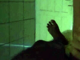 Black woman gently puts the young girl to breastfeed in a tender moment.