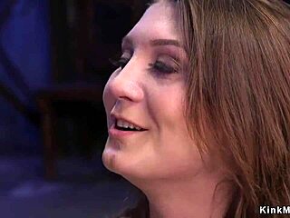 Brunette slave bent over in bondage gagging