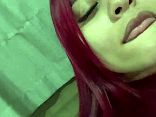 Redhead amateur flaunts big natural tits on video call.