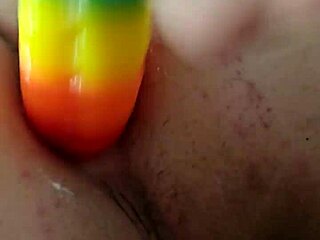 Rainbow Dildo Penetrates Anal Creampie