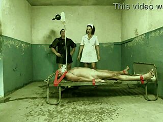 Dominatrix Mistress April Conducts Secret Interrogation with Strapon in Military Camp Bondage