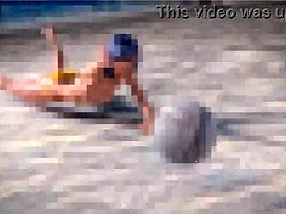 is this petite redhead topless on the beach with a thug?