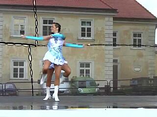 Two nice majorettes perform cheerleading routine