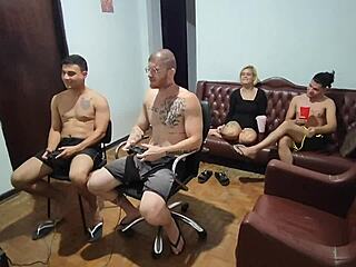 Friends playing video games turn to assfucking with big cocks.