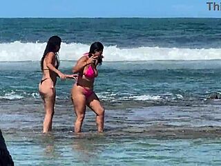 Two beautiful girls enjoy the beach at Enseada dos Corais in Cabo