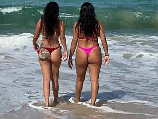 Two beautiful girls enjoy the beach at Enseada dos Corais in Cabo