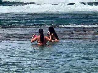 Two beautiful girls enjoy the beach at Enseada dos Corais in Cabo