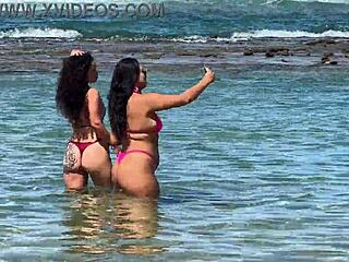 Two beautiful girls enjoy the beach at Enseada dos Corais in Cabo