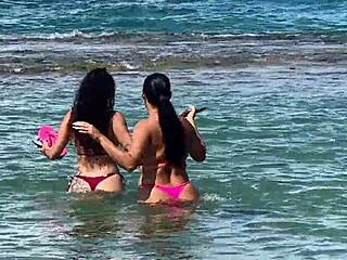 Two beautiful girls enjoy the beach at Enseada dos Corais in Cabo