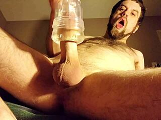 Feeling the intense pleasure as cum fills the clear fleshlight deeply