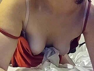 Clothed in red satin panties, she gets fucked doggystyle with rimming