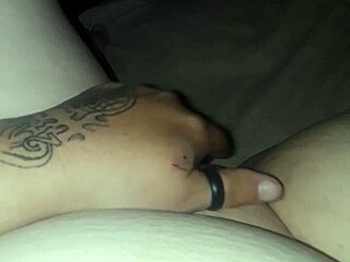 A woman engages in self-pleasure through masturbation