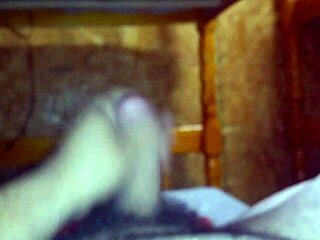 i'm jerking off on the bed, stroking my cock slowly.