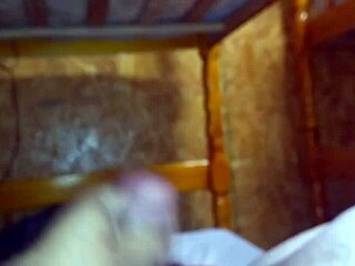 i'm jerking off on the bed, stroking my cock slowly.