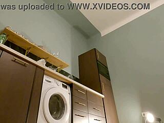 hot brunette babe removes panties under mini skirt in kitchen