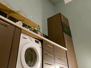 hot brunette babe removes panties under mini skirt in kitchen