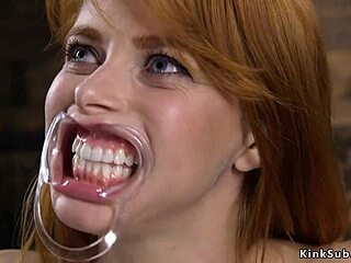 The natural busty redhead is bound in stock and whipped roughly