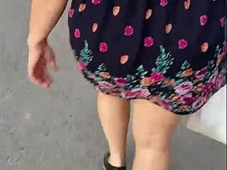 Mature woman in skirt upskirt on the street gives away