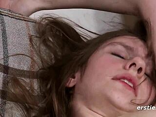 Passionate German plays with her shaved pussy, touching clit and nipples solo