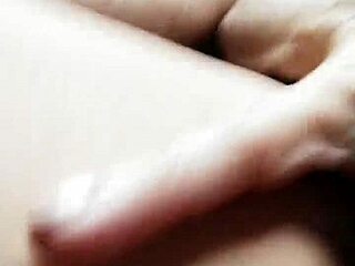 Woman uses pink vibrator during intense session in both openings.