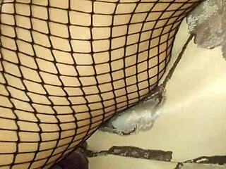 Cute couple explores lingerie and stockings in mature bedroom scene.