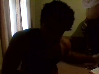 The naked workout features a black mature woman with big natural tits exercising freely.