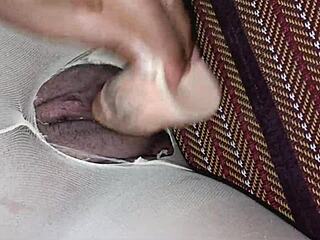 Casual scene where a sexy Thai student gets her tight shaved pussy pleasured with a toy through ripped stockings.