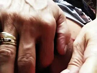 Woman uses pink vibrator during intense session in both openings.