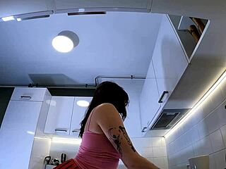 Hey, check out this hottest redhead tattooed cheerleader in over knee socks flashing see through panties in kitchen?