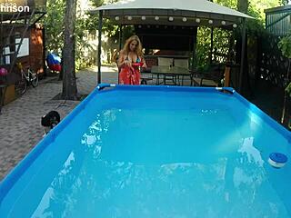 Melissa the Mermaid Swims Gracefully in the Pool with Tattoos and Brown Eyes