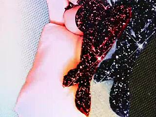 Dominant bitch in latex boots and glasses demands financial submission during fetish slave session